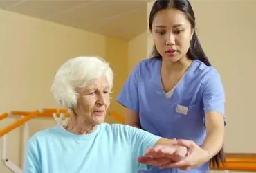 Home nurse checking a patient's vital signs